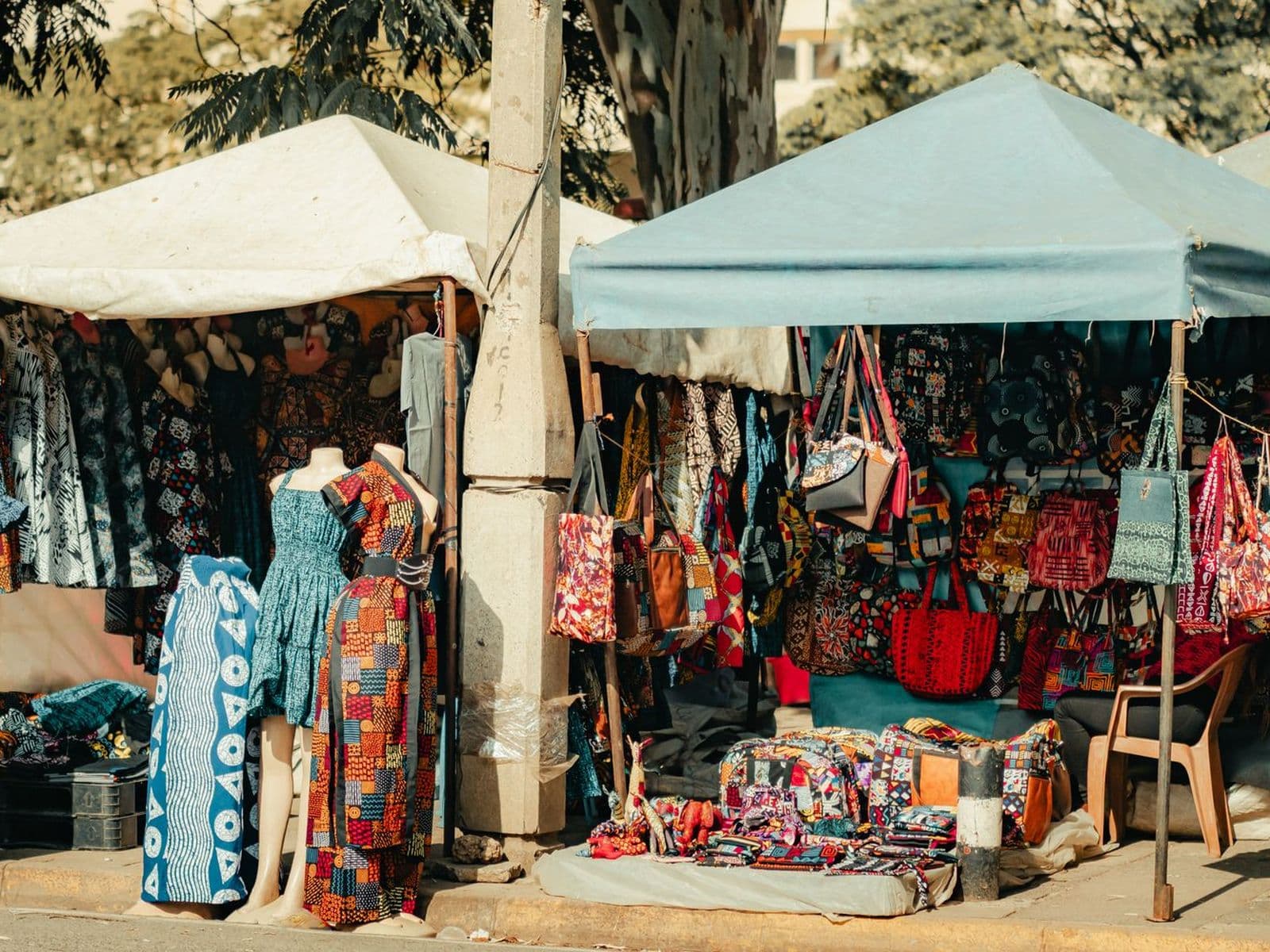 Kitenge dresses and bags on display at textile stalls